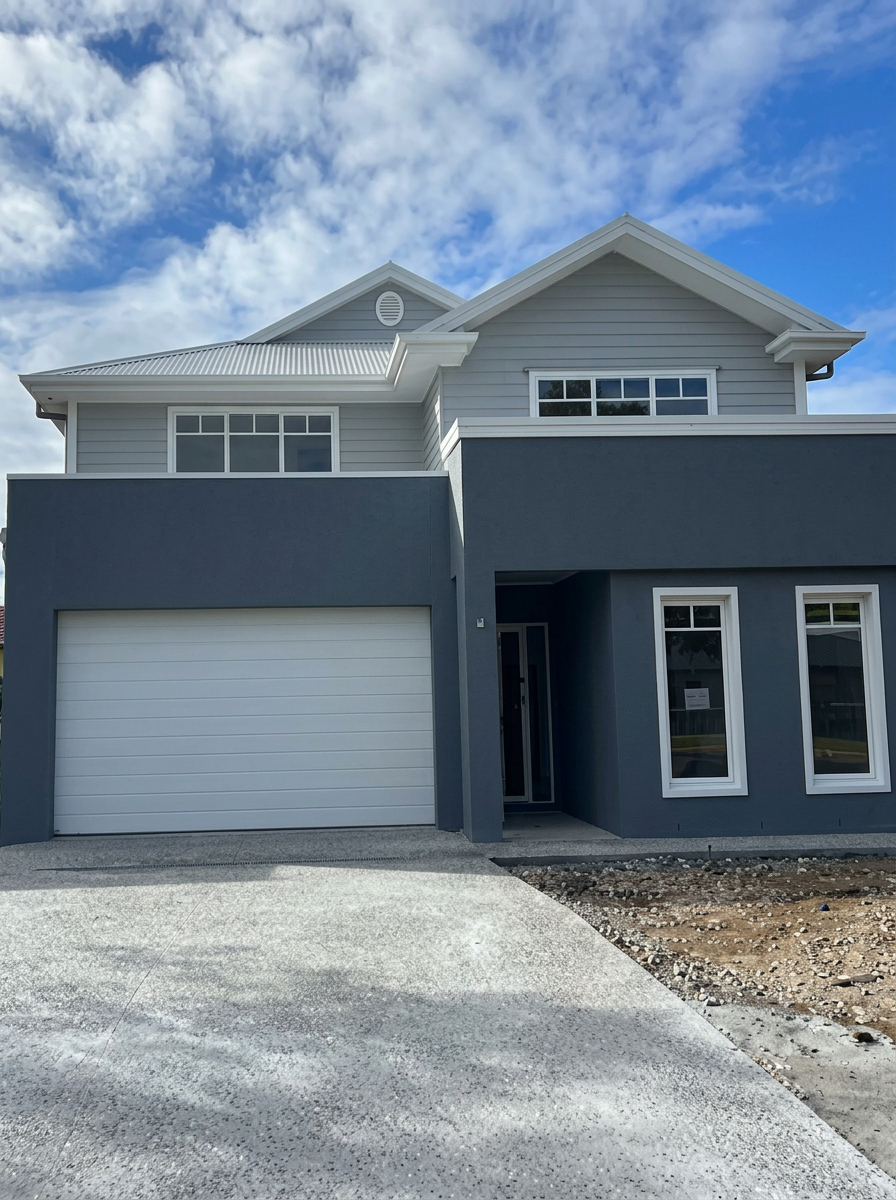 Charcoal rendered family home with white trim